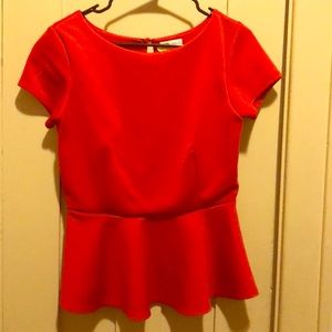 Midriff forgiving peplum top